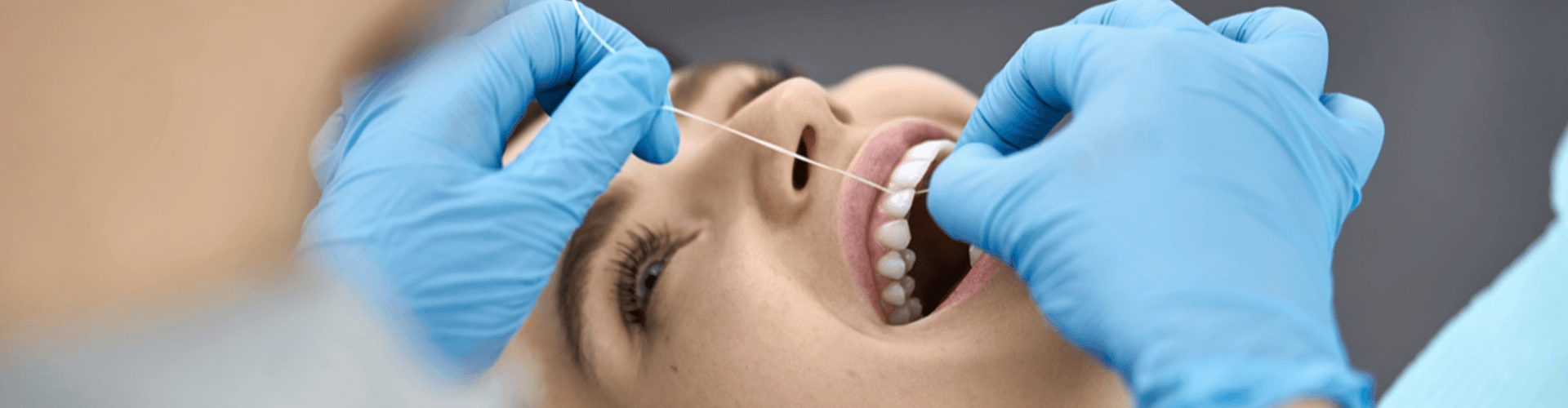 female having her teeth cleaned